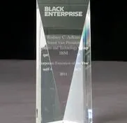 A glass award with the words black enterprise on it.