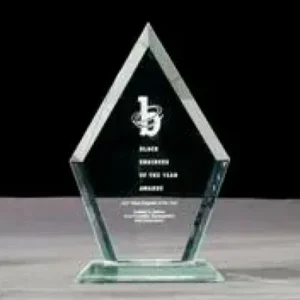 A glass award with the words " black brethren of this year."