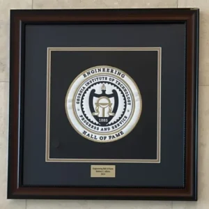 A framed picture of the seal of the engineering hall of fame.